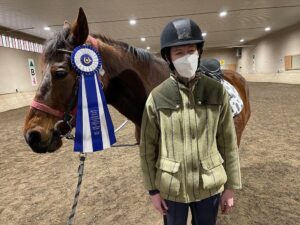 Rider living with disability and horse with award